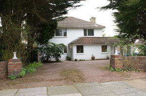 Picture of a white detached house